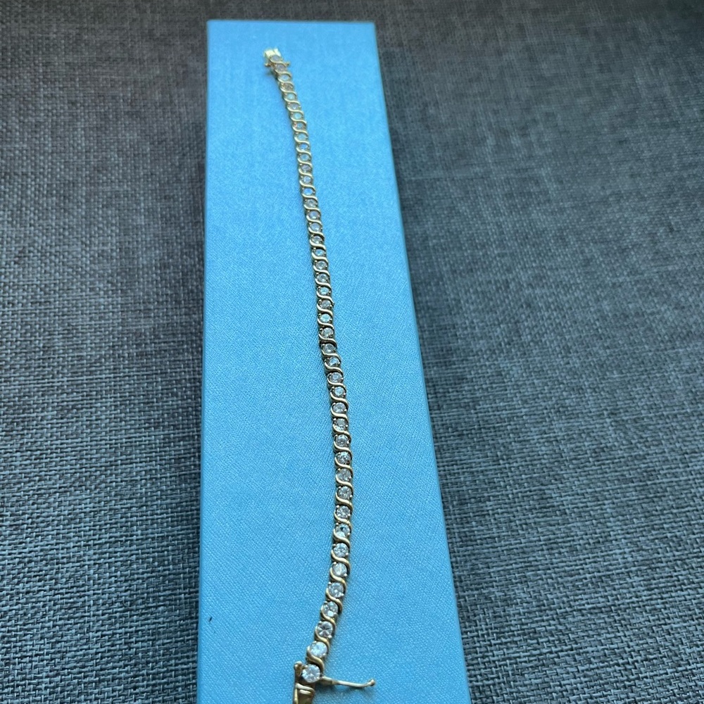 Custom jewelry tennis bracelet with stones 
Double clasp, gold color, Pre owned